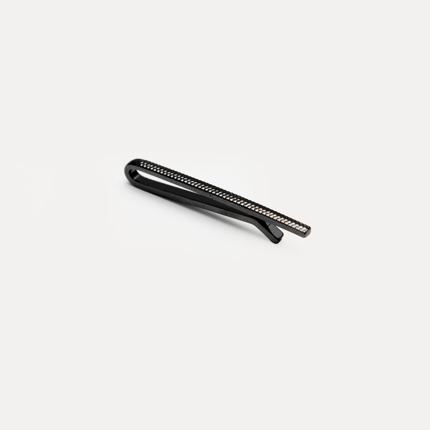 Metallic cylindrical component on a white background