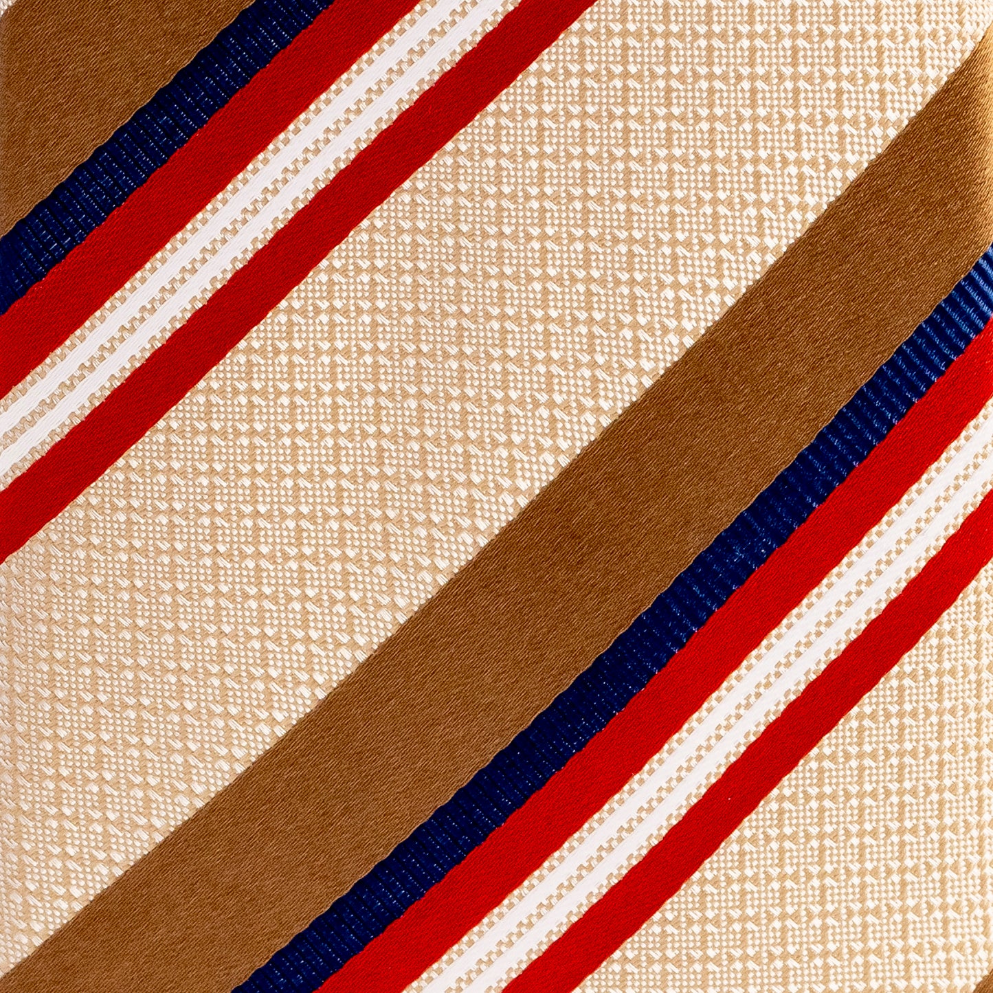 Close-up of a fabric with red, blue, and beige stripes on a textured beige background