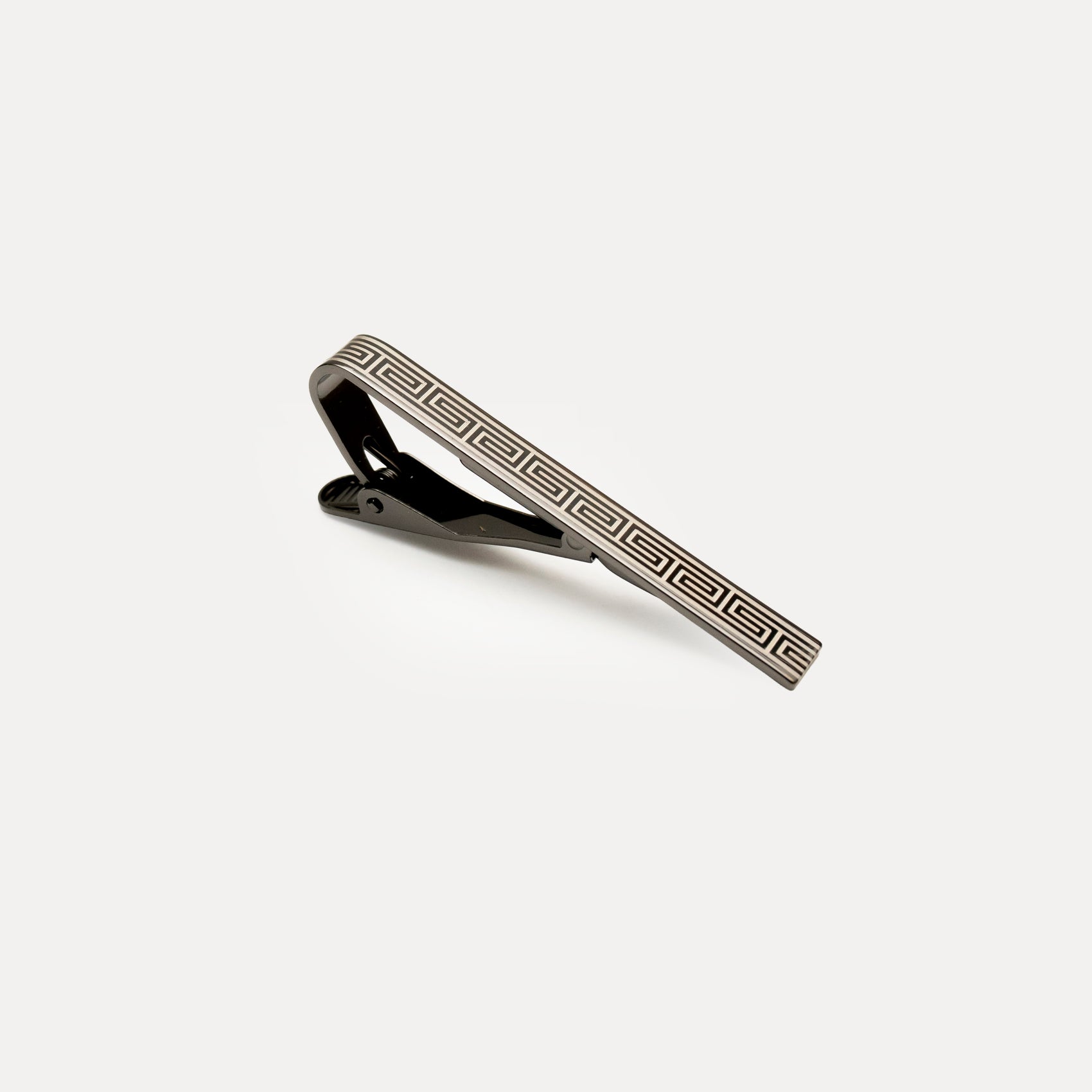 Tie clip with geometric pattern on a white background