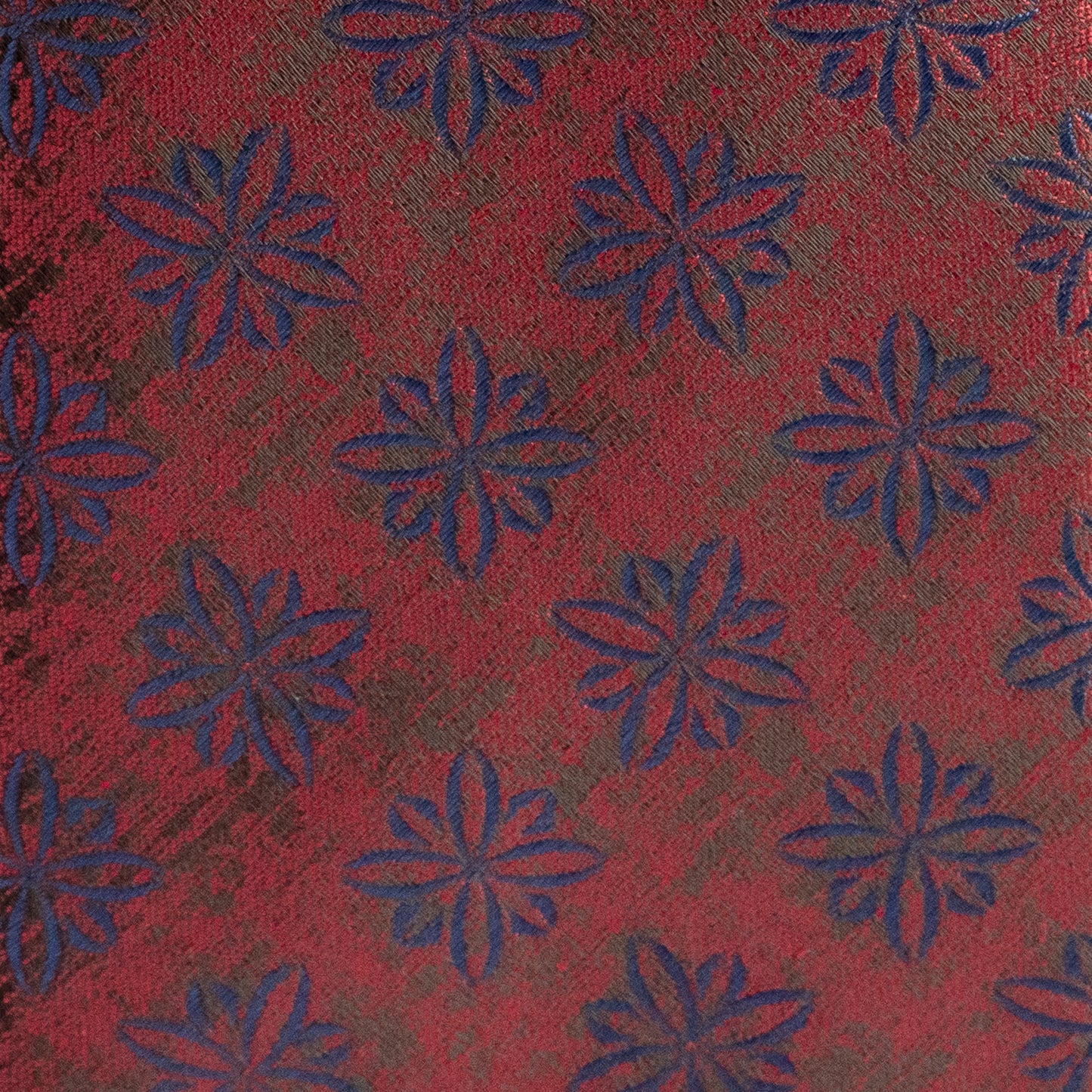 Red fabric with blue floral patterns