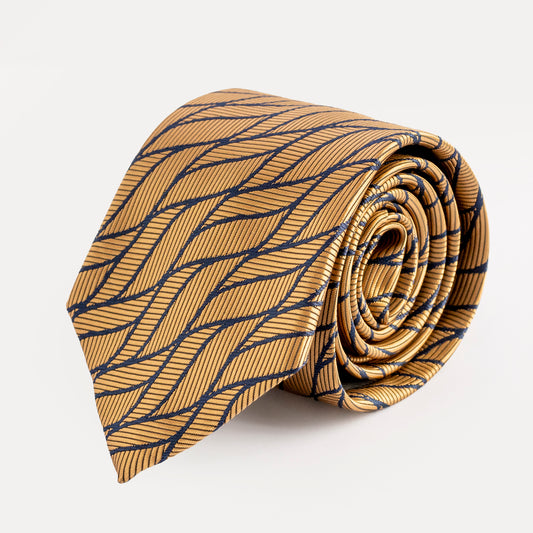 Roll of gold tie with blue pattern on a white background
