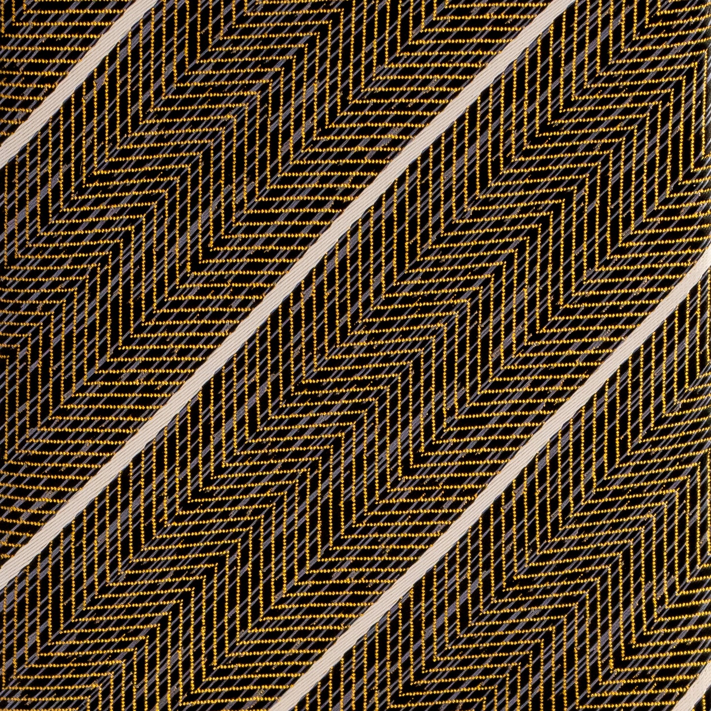 Textured pattern with gold zigzag lines on a black background
