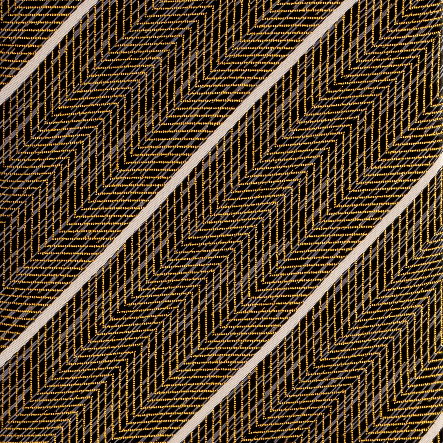 Textured pattern with gold zigzag lines on a black background