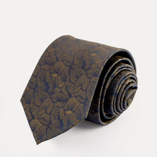 Folded patterned tie on a white background