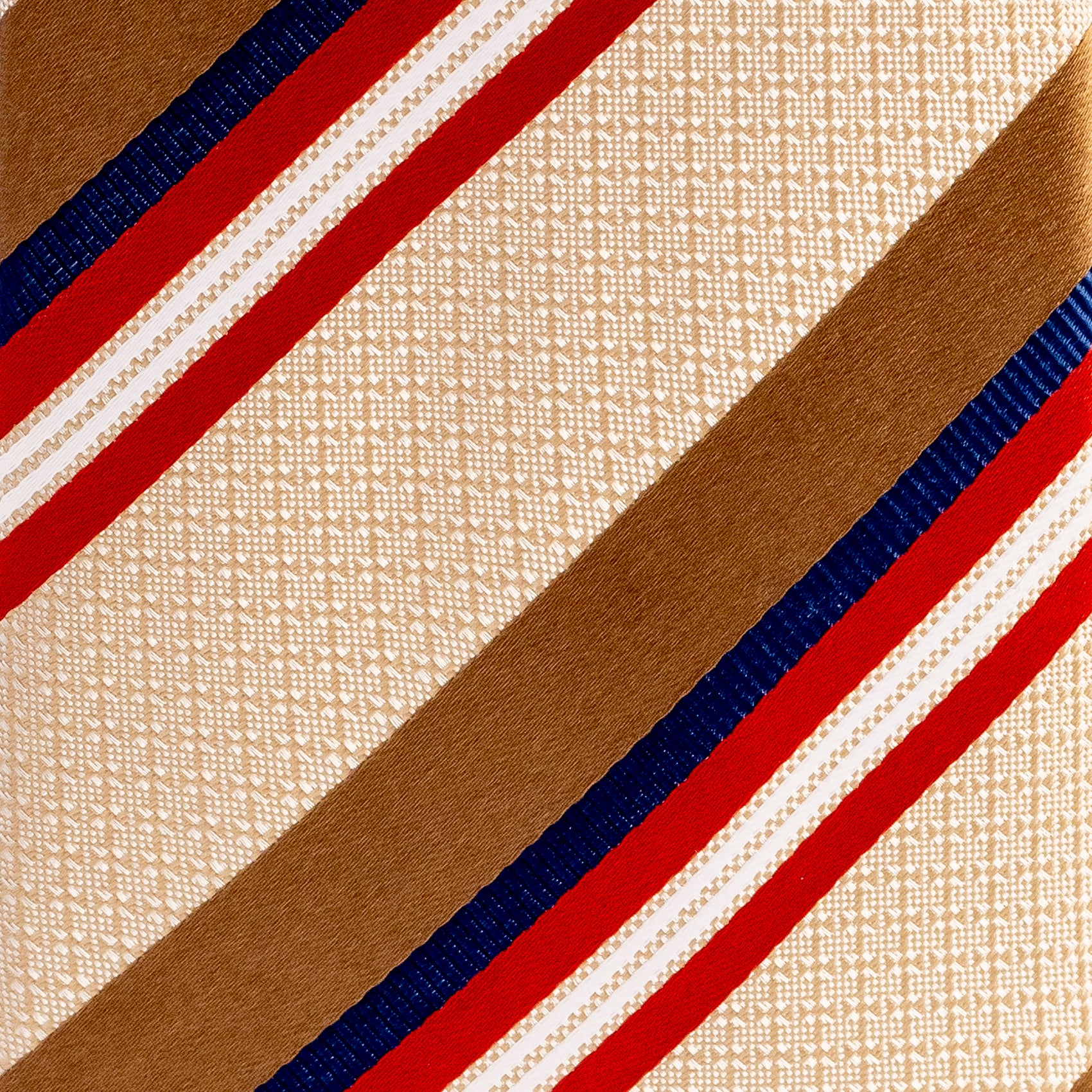 Close-up of a fabric with red, blue, and beige stripes on a textured beige background