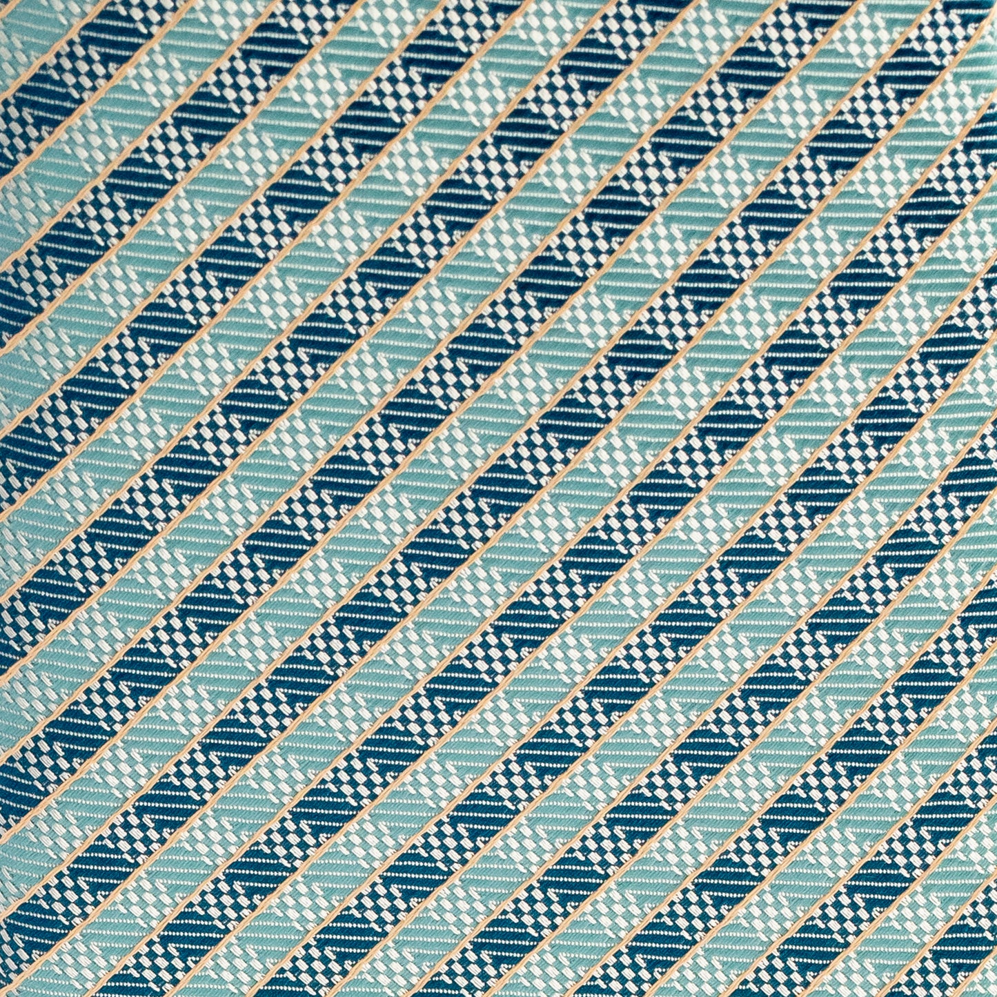 Diagonal striped pattern in blue and green on a textured fabric background