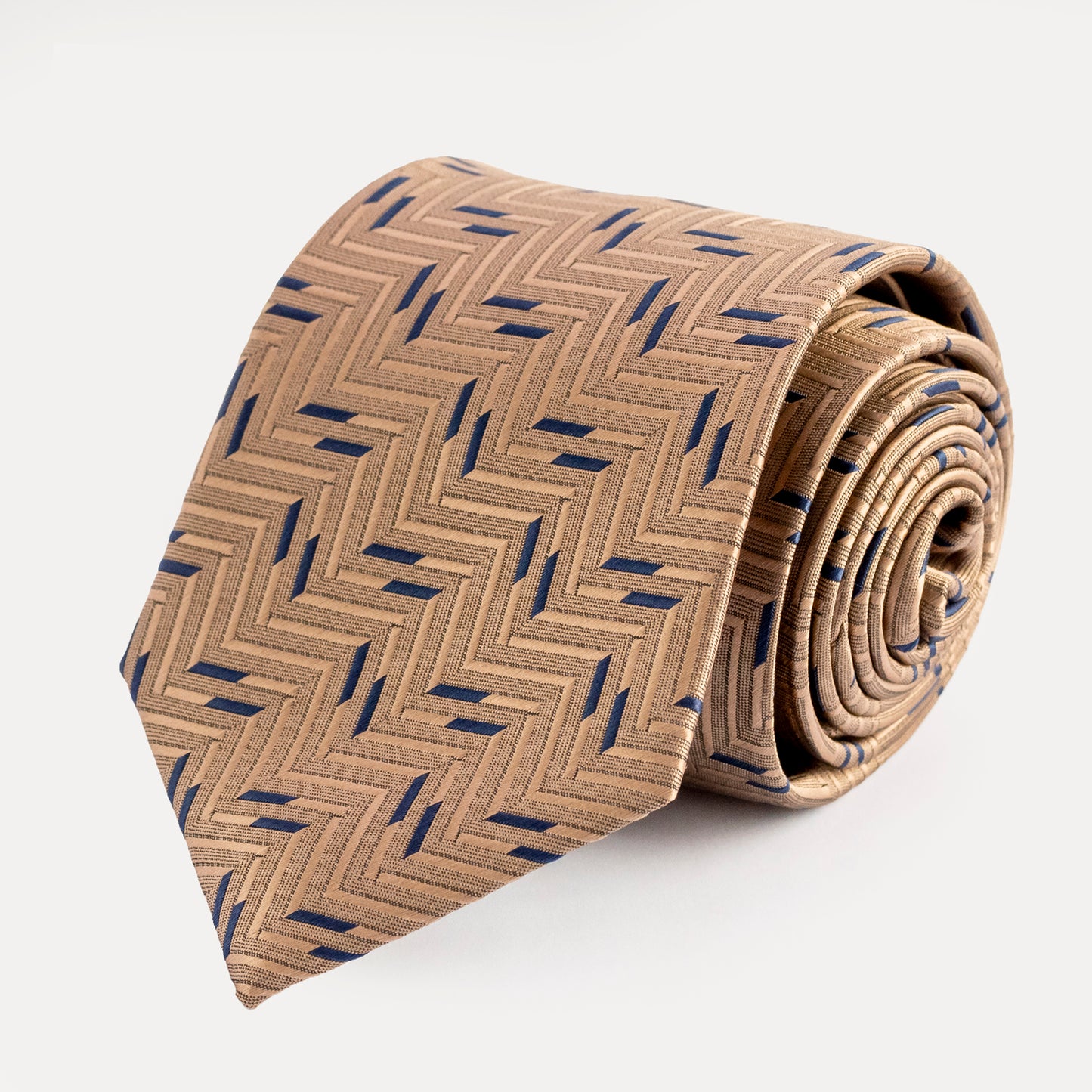 Beige tie with blue geometric pattern on a white background