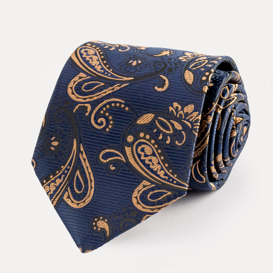 Folded navy blue tie with gold paisley pattern on a white background