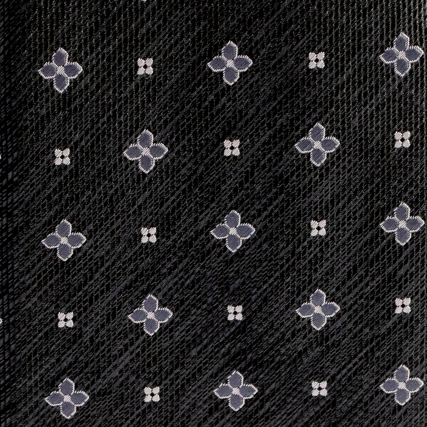 Pattern of flowers on a textured black background