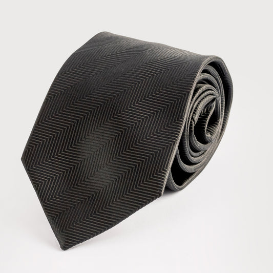 Black patterned tie on a light gray background