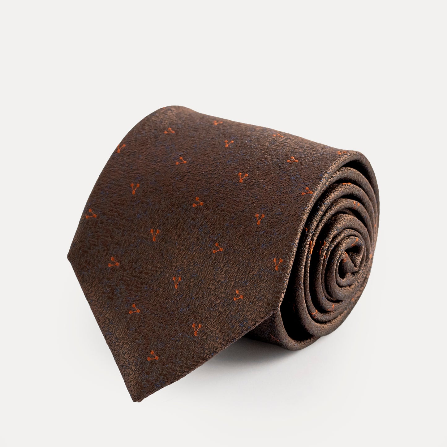 Brown patterned tie on a white background