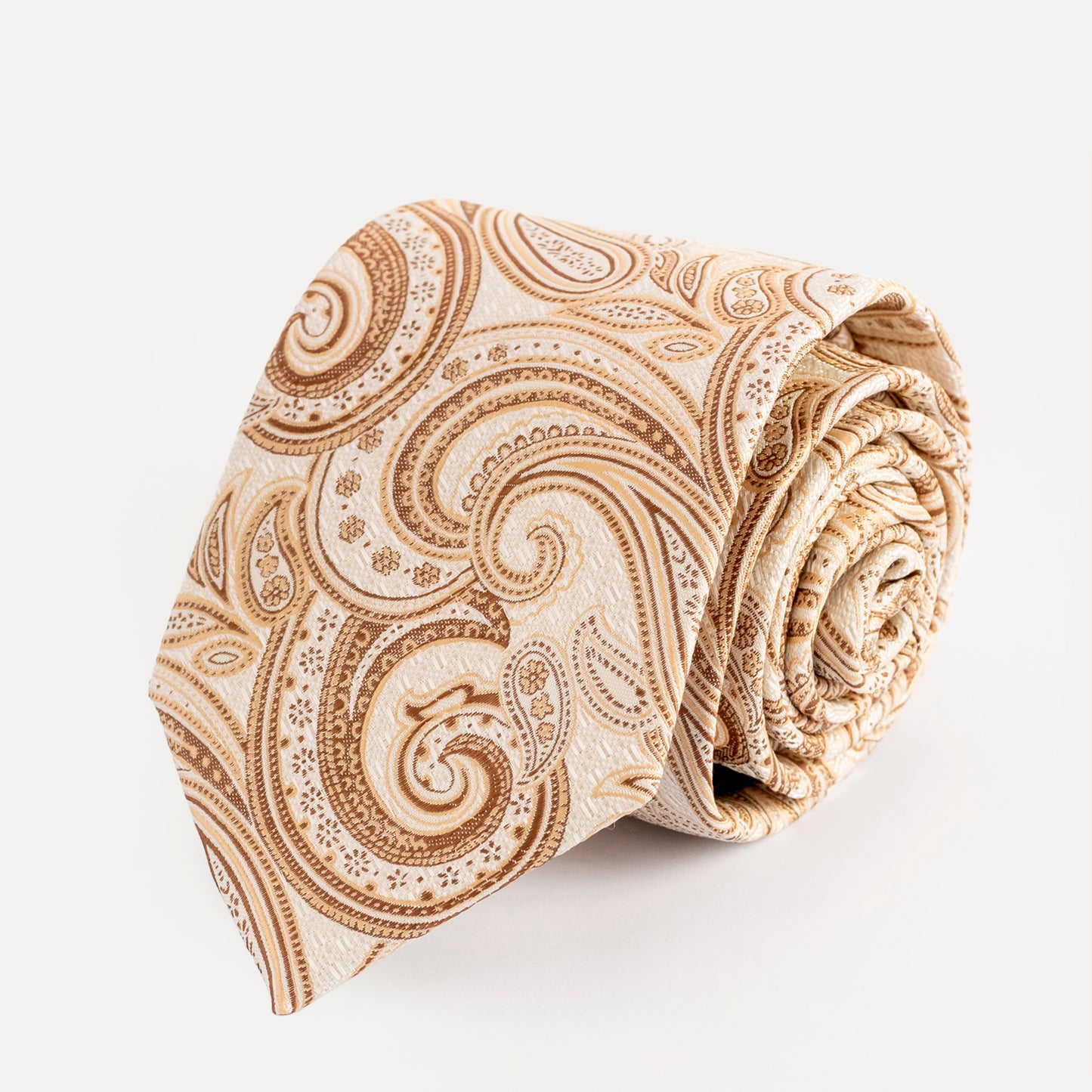 Beige paisley patterned tie on a white background