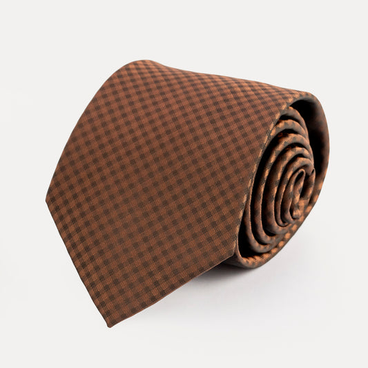 Brown checkered tie on a white background