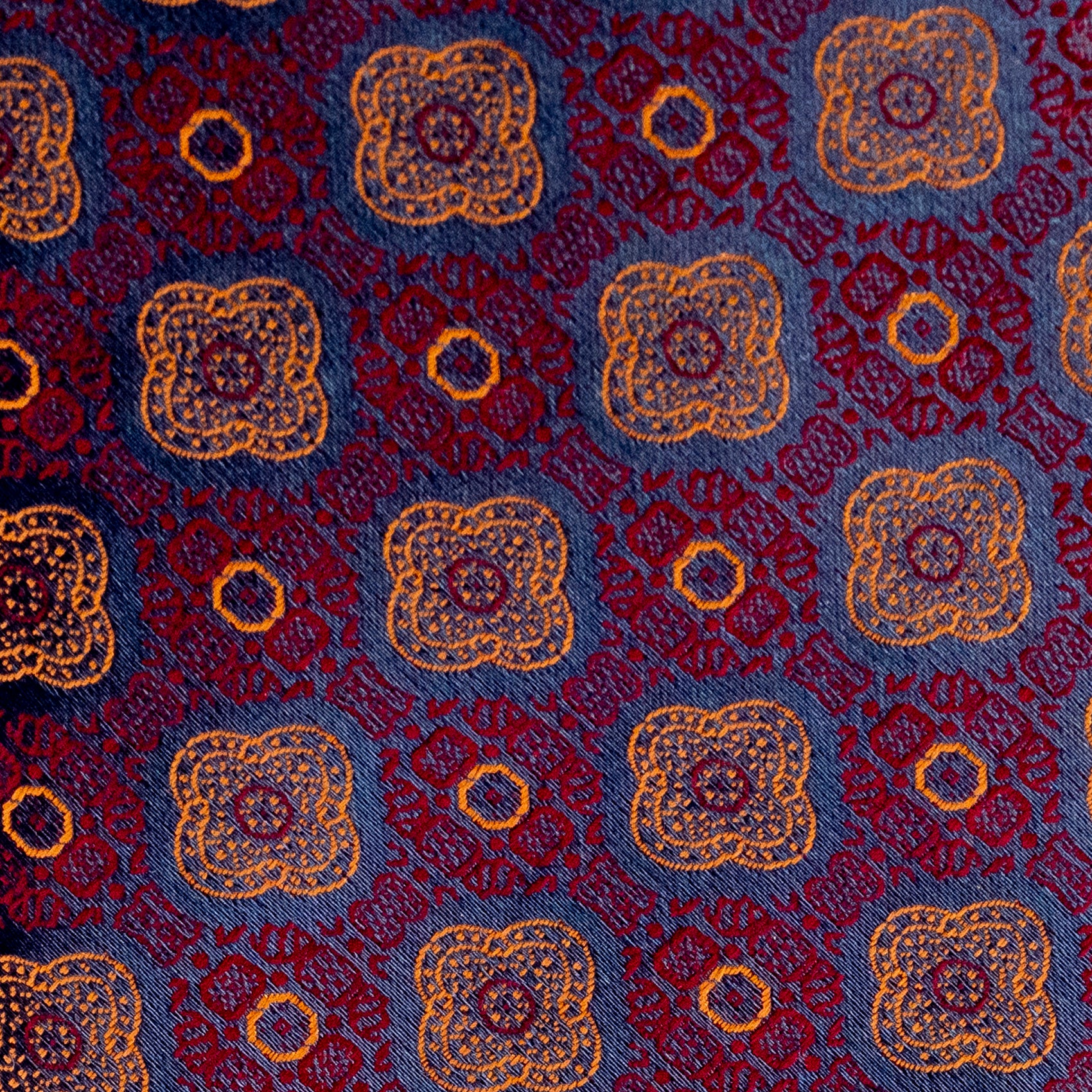 Patterned fabric with blue, red, and gold colors