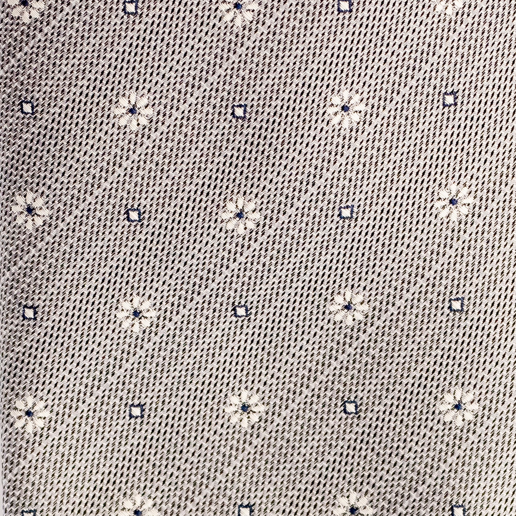 Close-up of a textured fabric with small floral patterns