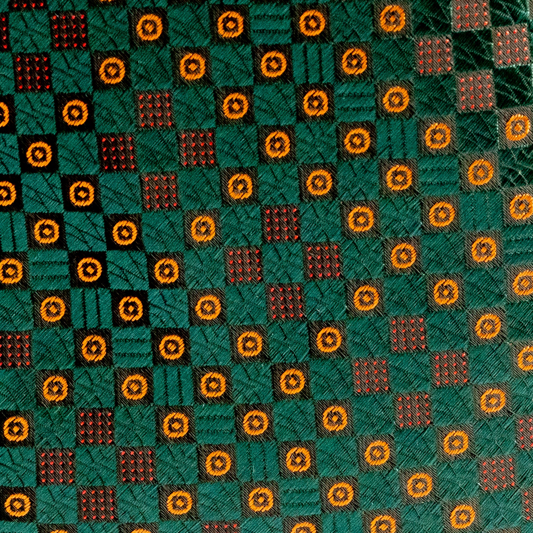 Patterned fabric with geometric design on a green background