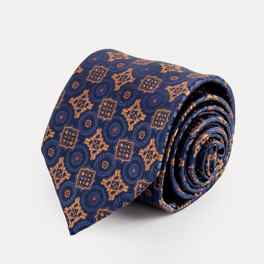 Rolled-up patterned tie on a white background