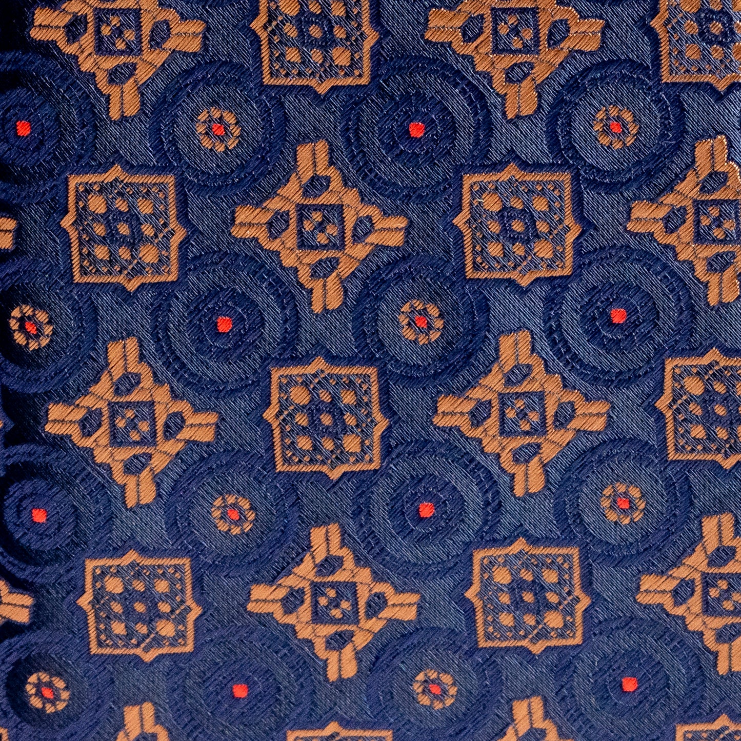 Patterned fabric with geometric design on a blue background