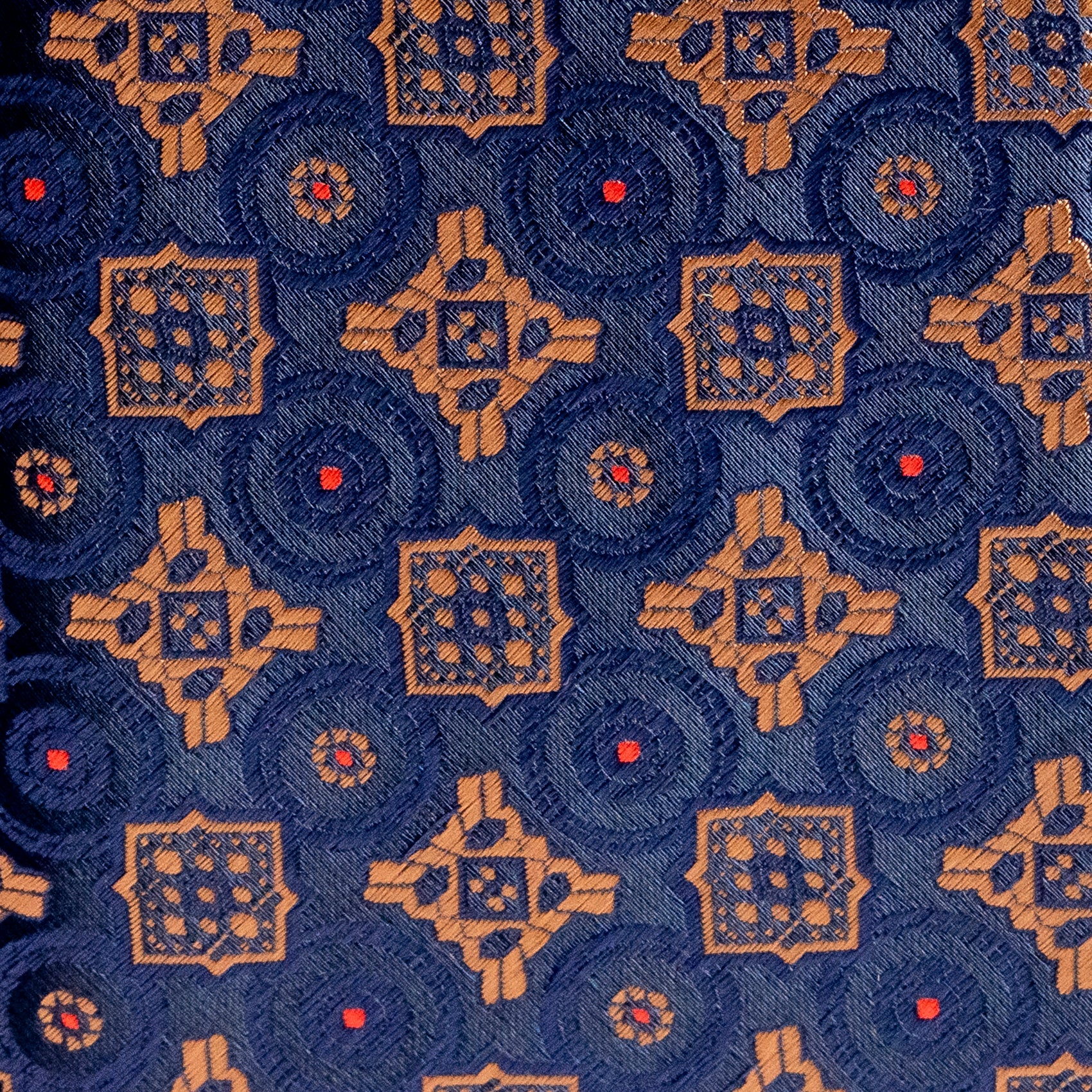 Patterned fabric with geometric design on a blue background