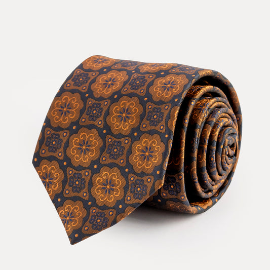 Roll of patterned tie on a white background