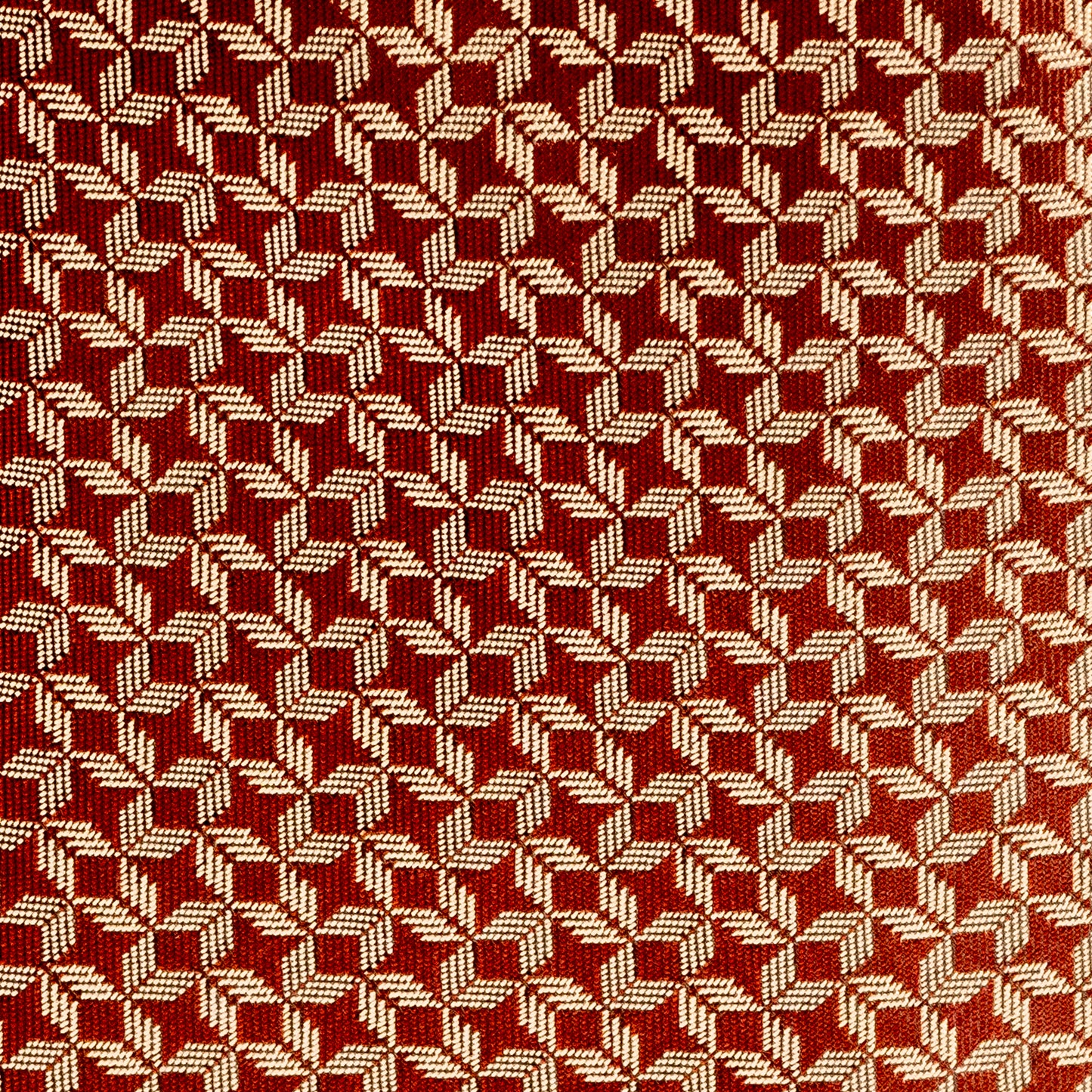 Close-up of a red and beige woven pattern