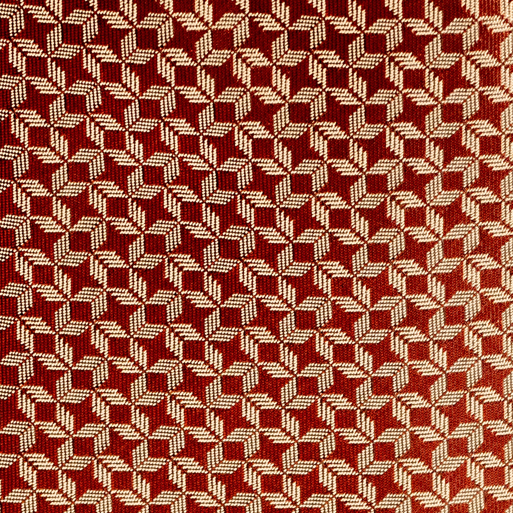 Close-up of a red and beige woven pattern