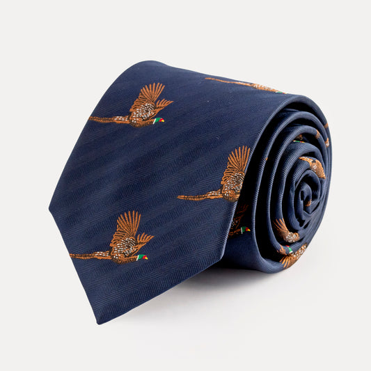 Navy blue tie with bird embroidery on a light gray background