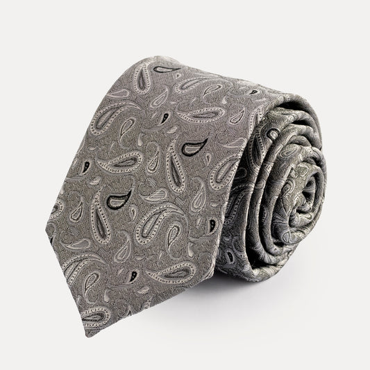 Rolled-up gray paisley tie on a white background