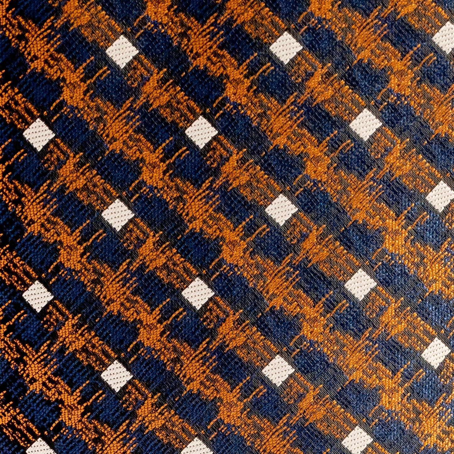 Patterned fabric with blue, orange, and white squares