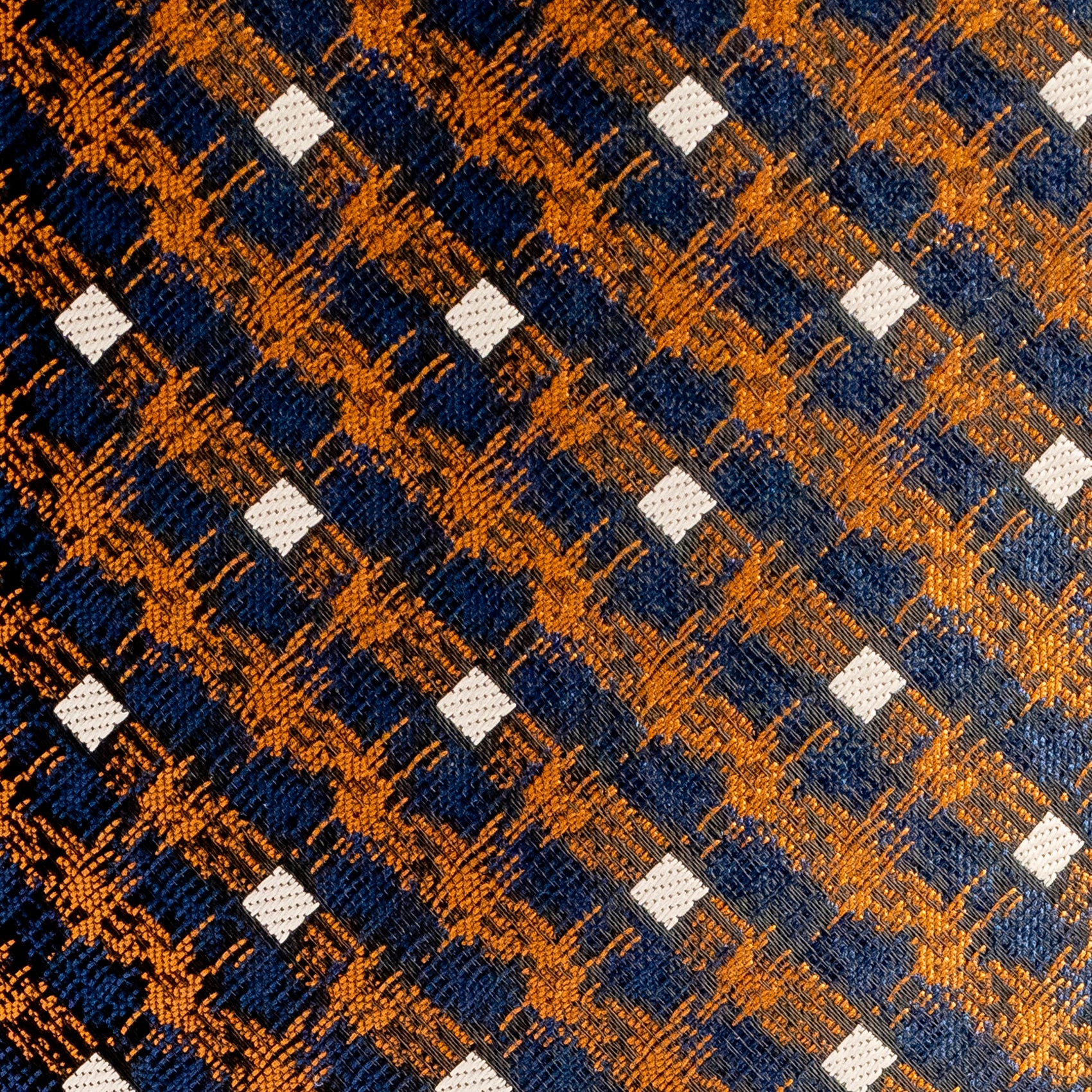 Patterned fabric with blue, orange, and white squares
