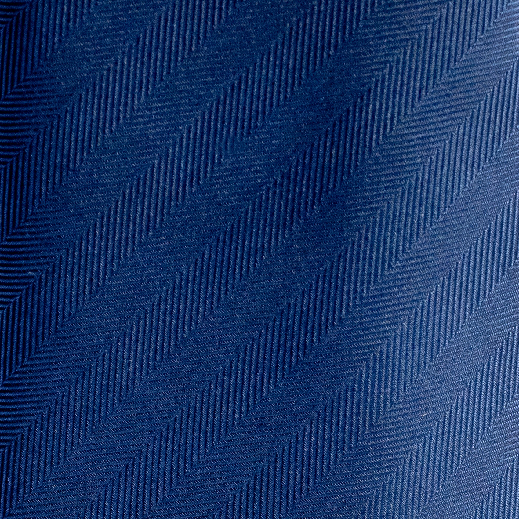 Close-up of blue fabric with a zigzag pattern