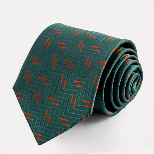 Green tie with red pattern on a white background