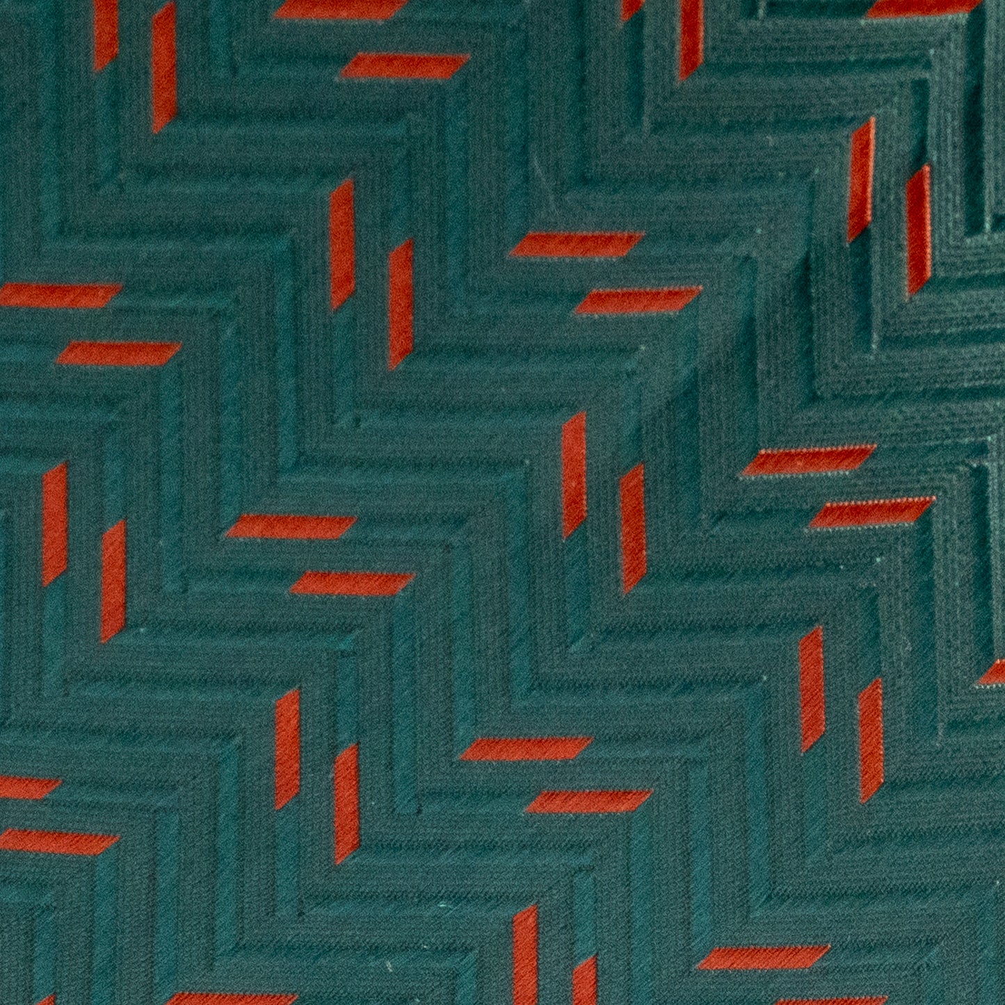 Textured pattern with alternating red and teal squares