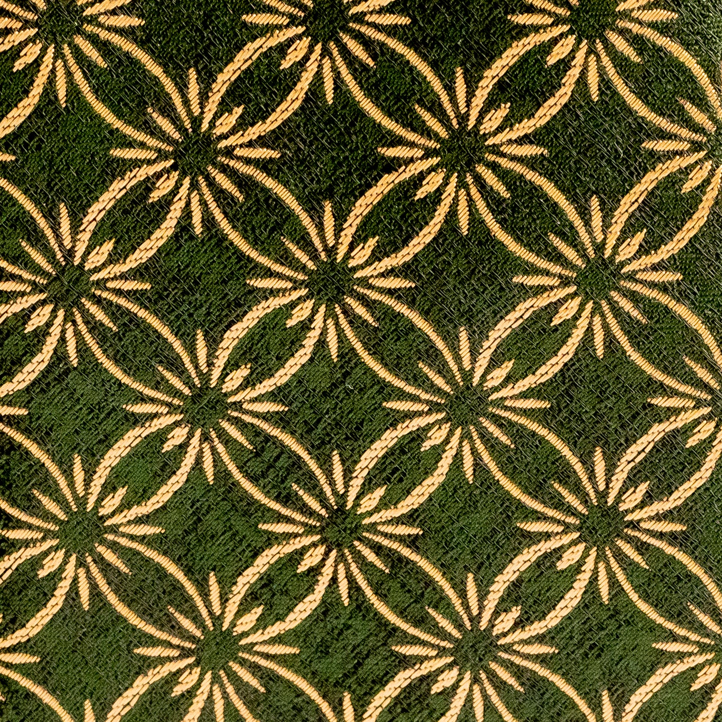 Patterned fabric with geometric design on a green background