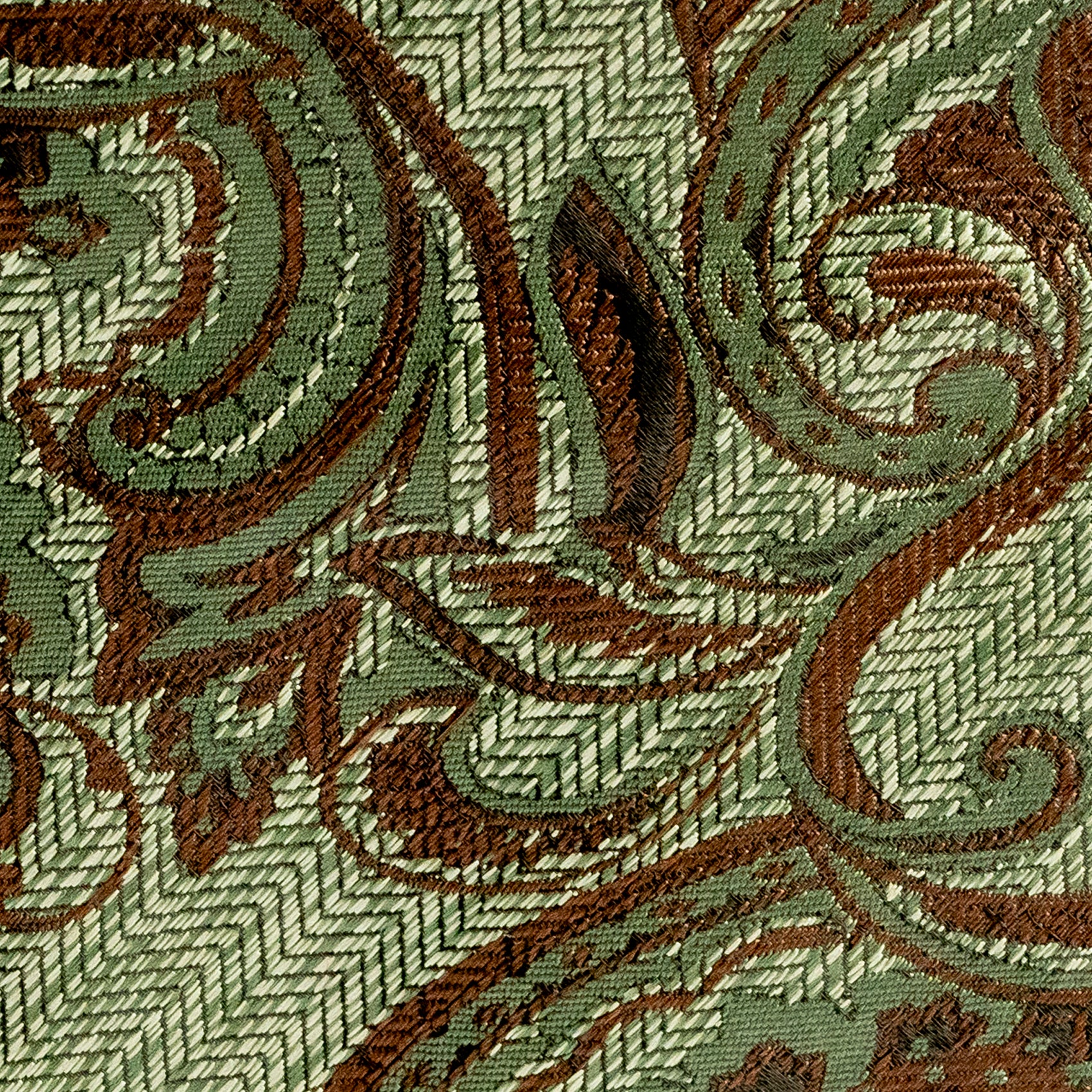Close-up of a patterned fabric with brown and green design