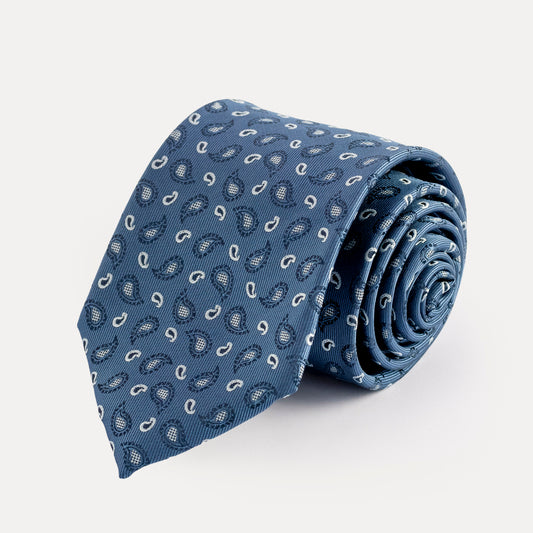 Rolled-up blue tie with pattern on a light gray background