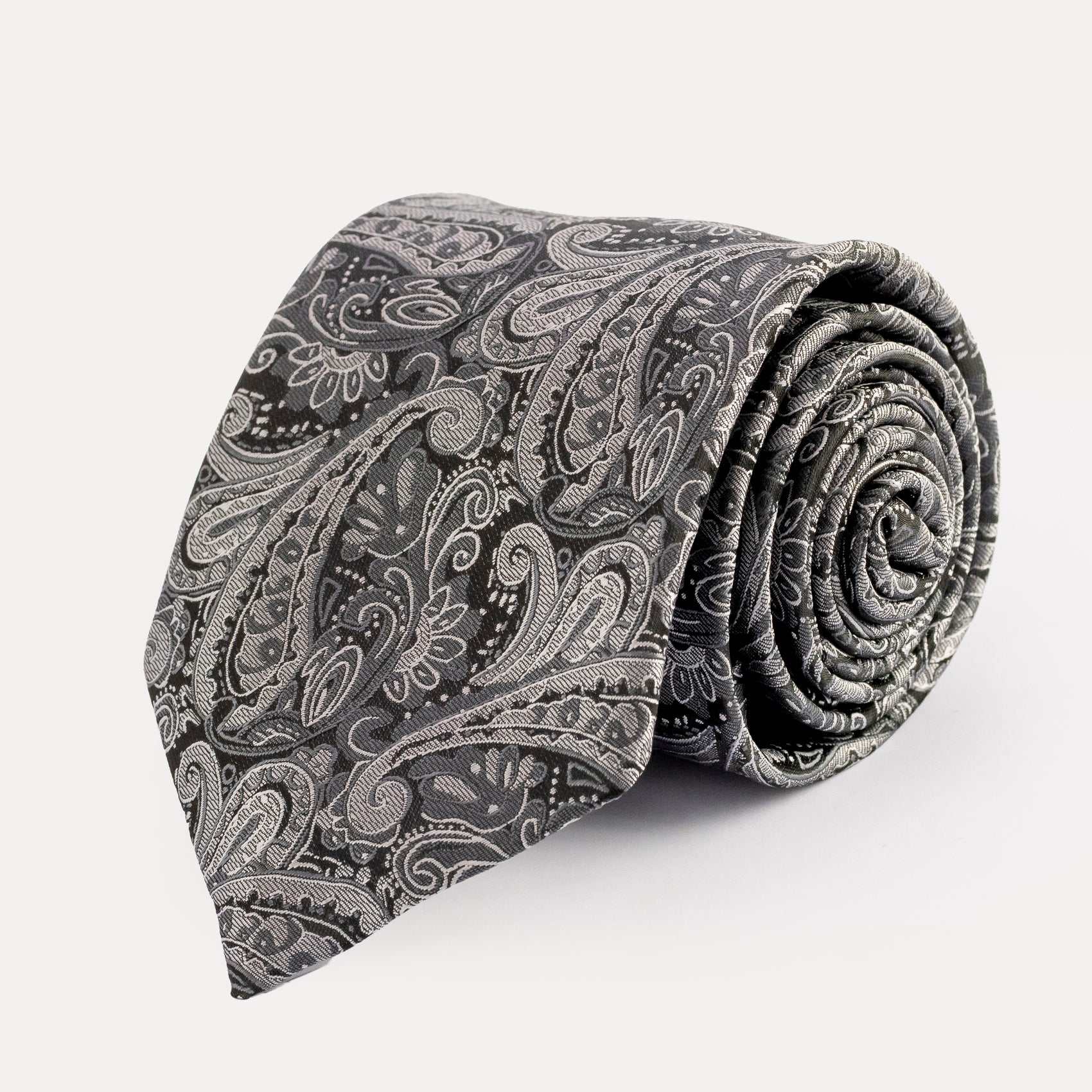 Rolled-up gray paisley tie on a white background