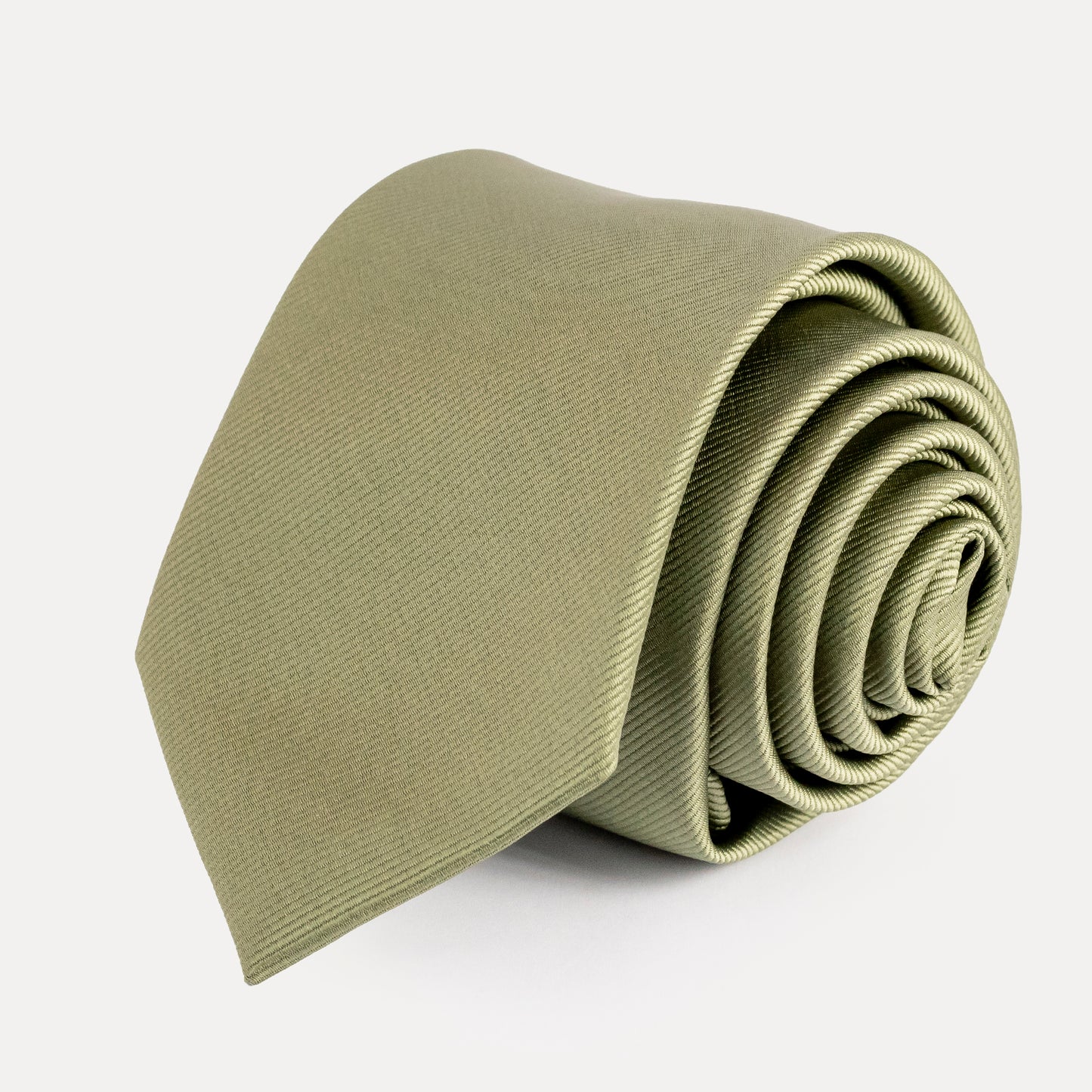 Rolled-up olive green tie on a white background
