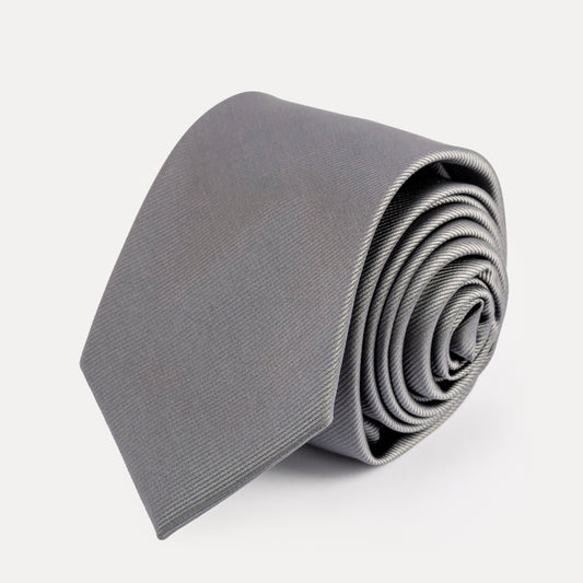 Rolled gray tie on a white background