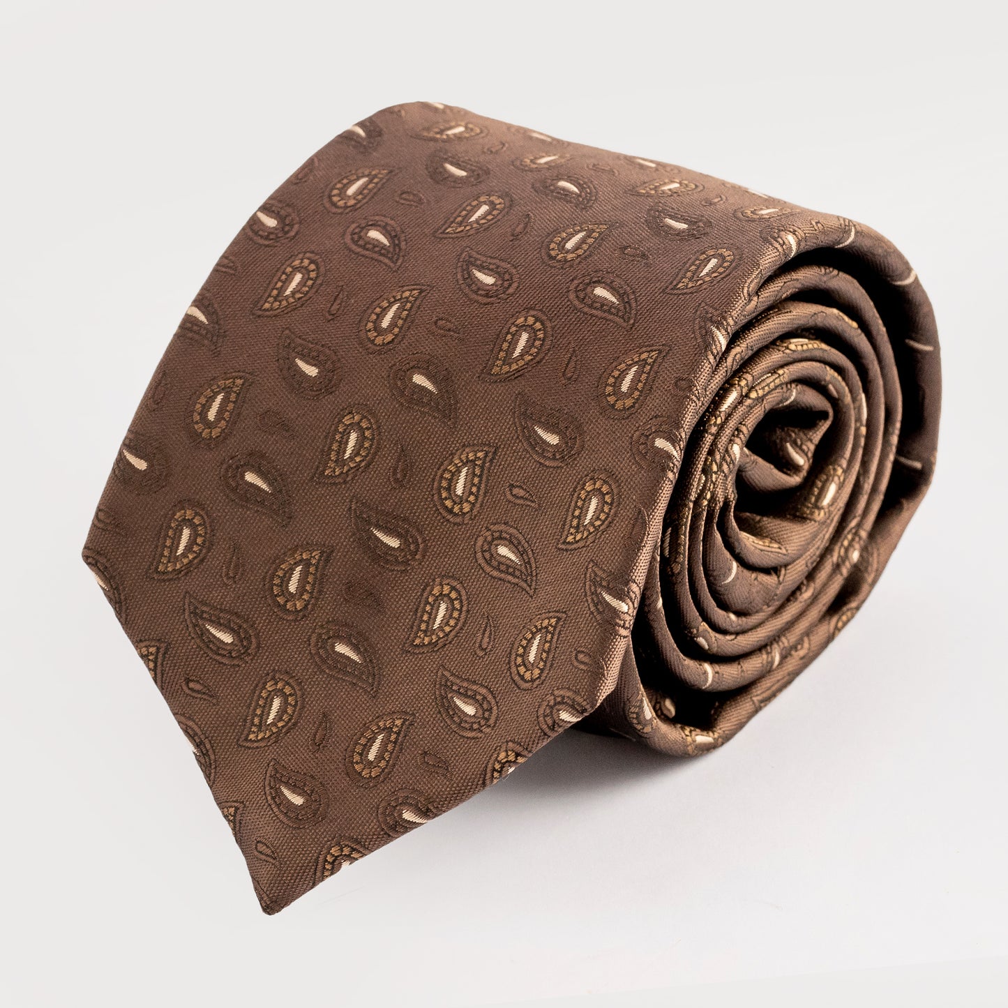 Brown patterned tie on a light gray background