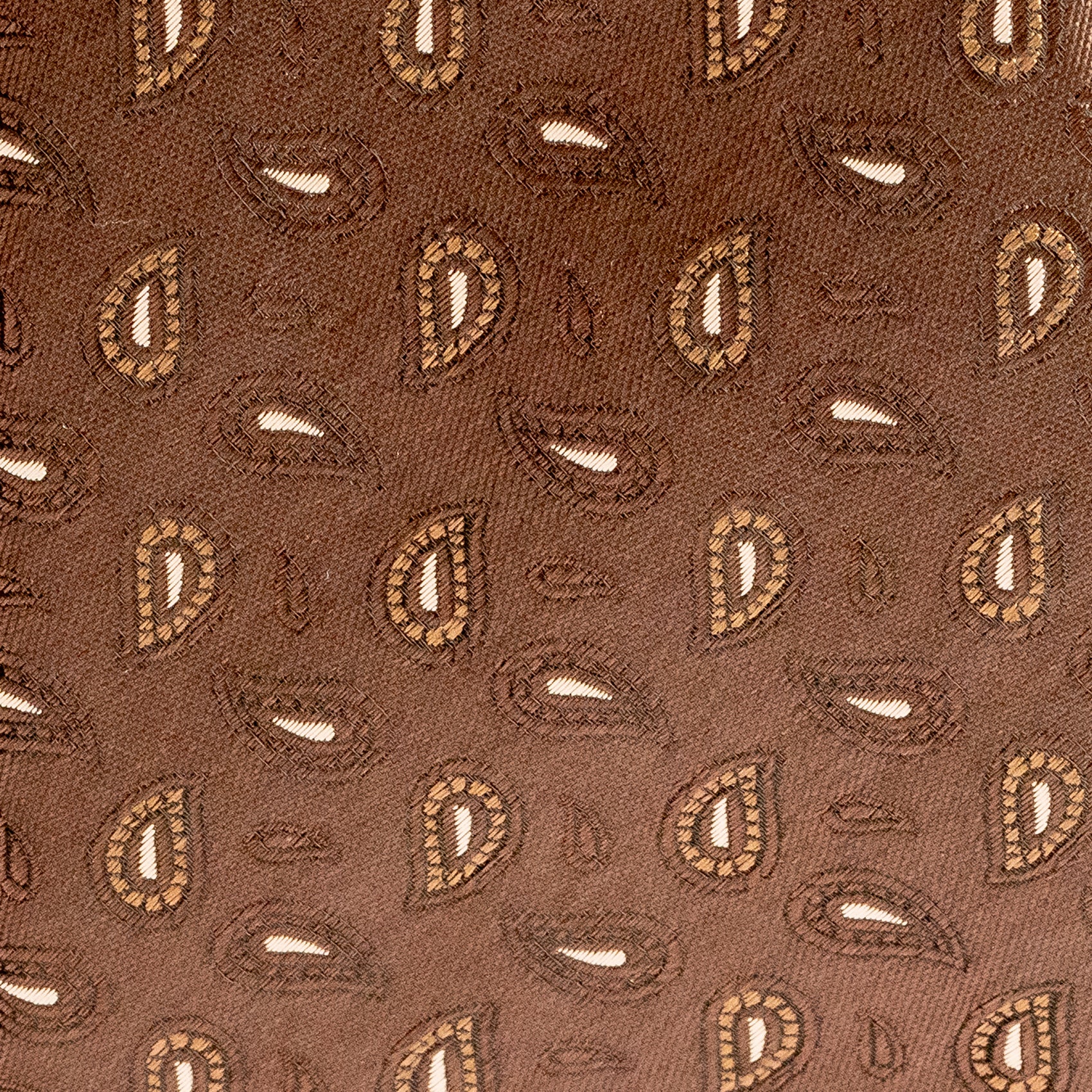 Close-up of brown fabric with a subtle pattern